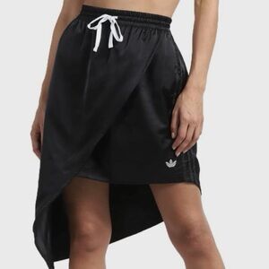 ADIDAS Asymmetrical skirt in Black
Size: Size  small Streetwear modern cool